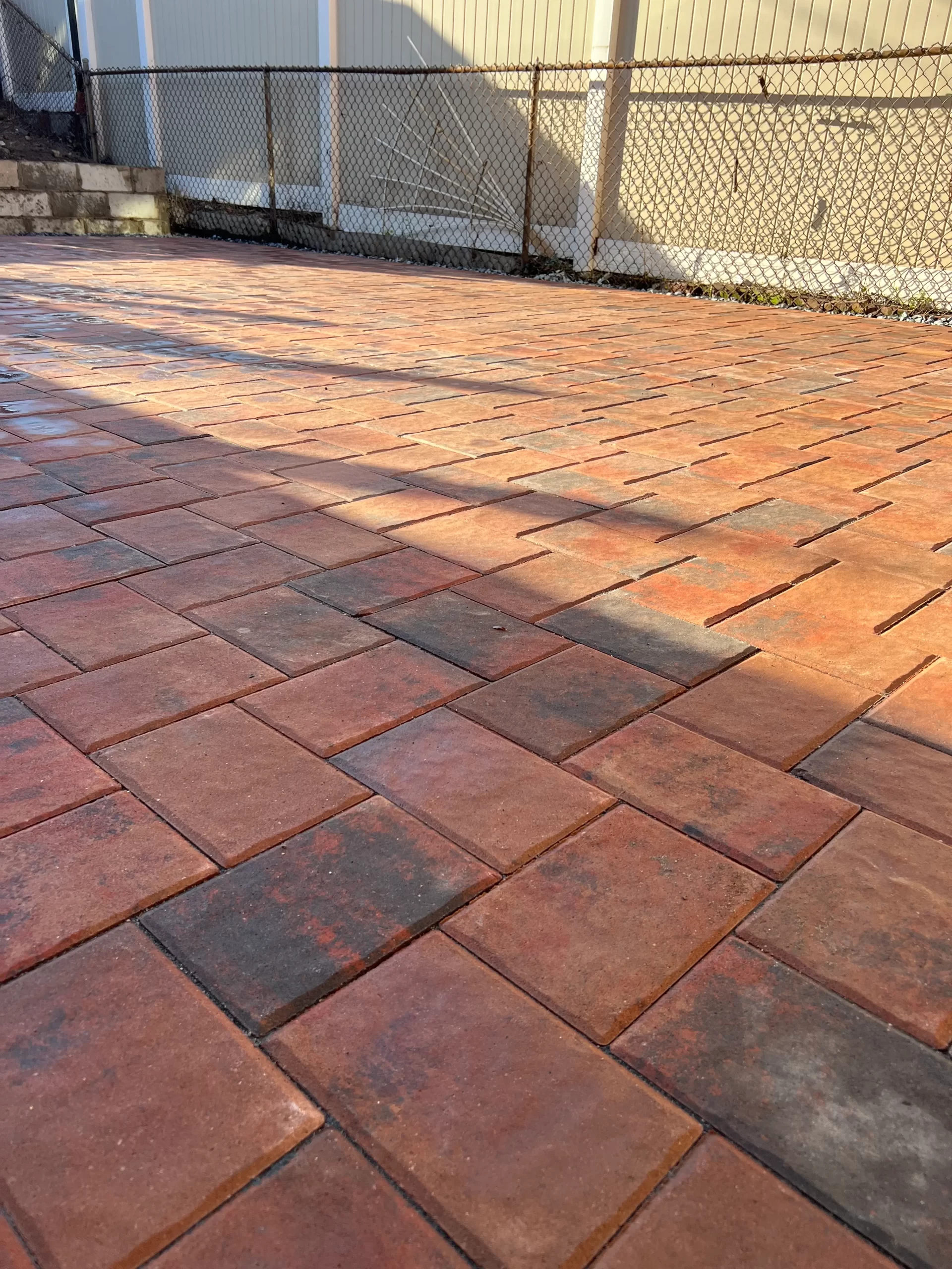 Custom Brick Paver Patio Installation in NYC - Decks N' Stones Paver patio installation in New York City by Decks N' Stones